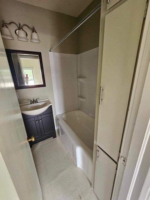 20051 Capital Ave NE, Battle Creek, MI 49017 - full bathroom with vanity,  shower combination, and tile patterned floors