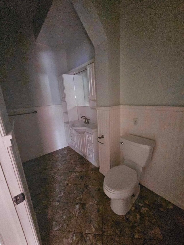 20051 Capital Ave NE, Battle Creek, MI 49017 - bathroom featuring vanity and wainscoting