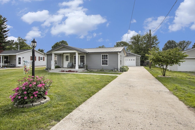 42 S 25th St, Battle Creek, MI 49015 - single story home with covered porch, a front lawn, and a metal roof