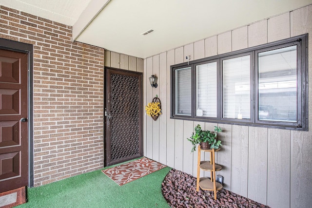 225 W Columbia Ave Unit 6, Battle Creek, MI 49015 - doorway to property with brick siding