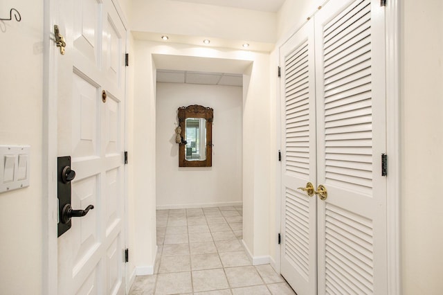 225 W Columbia Ave Unit 6, Battle Creek, MI 49015 - corridor with baseboards and light tile patterned floors