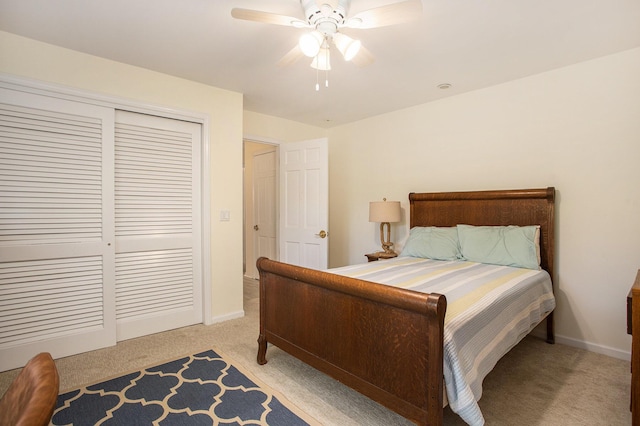 225 W Columbia Ave Unit 6, Battle Creek, MI 49015 - bedroom with light colored carpet, a closet, and ceiling fan
