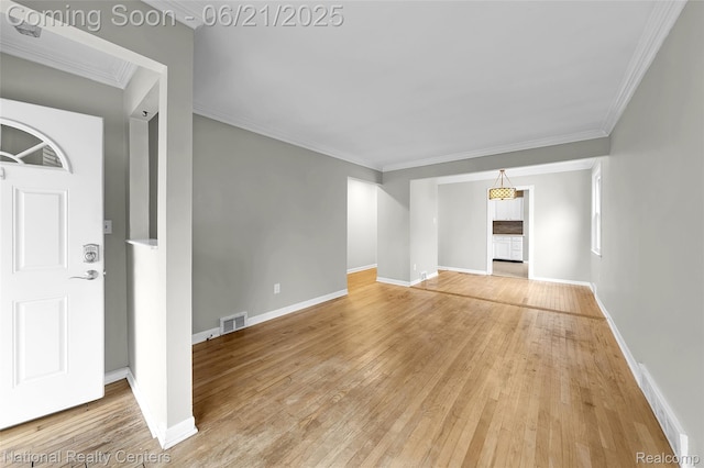 3572 Tyler Ave, Berkley, MI 48072 - unfurnished living room featuring light wood-style flooring and ornamental molding