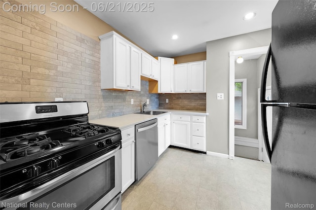 3572 Tyler Ave, Berkley, MI 48072 - kitchen with appliances with stainless steel finishes, white cabinets, backsplash, light countertops, and recessed lighting
