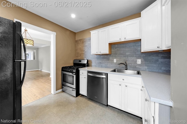 3572 Tyler Ave, Berkley, MI 48072 - kitchen with stainless steel appliances, decorative backsplash, and white cabinetry
