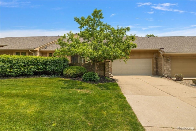 55728 Lorraine Dr Unit 20, Utica, MI 48316 - view of front of home featuring brick siding, a garage, a front lawn, driveway, and roof with shingles