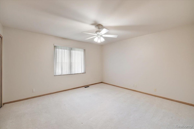 55728 Lorraine Dr Unit 20, Utica, MI 48316 - spare room with a ceiling fan and light colored carpet