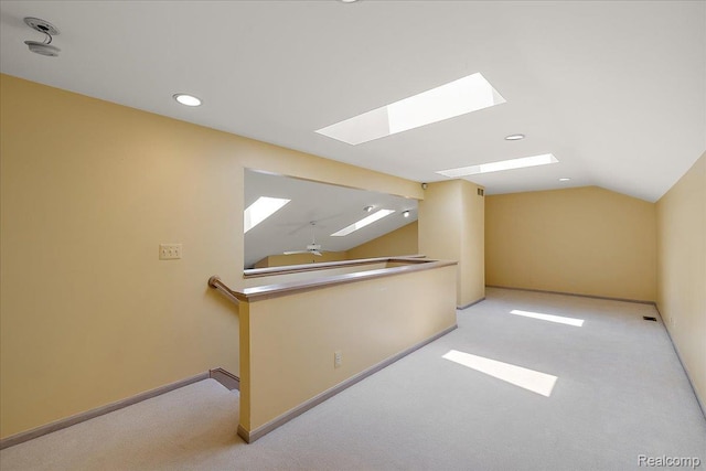 55728 Lorraine Dr Unit 20, Utica, MI 48316 - bonus room featuring a skylight, vaulted ceiling, carpet, and recessed lighting