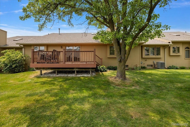 55728 Lorraine Dr Unit 20, Utica, MI 48316 - rear view of house featuring a deck and a lawn