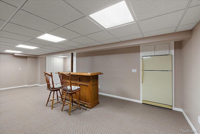 55728 Lorraine Dr Unit 20, Utica, MI 48316 - indoor dry bar featuring freestanding refrigerator, carpet floors, and a drop ceiling