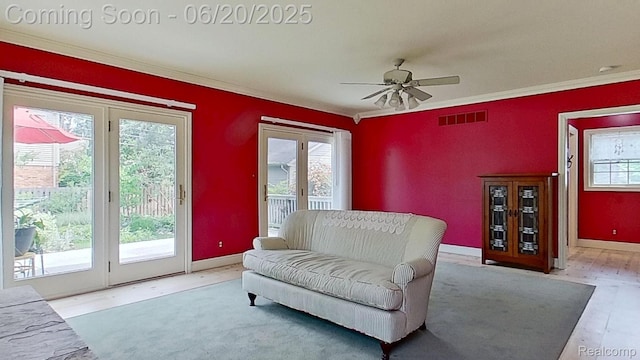 108 High St, Clawson, MI 48017 - living area featuring healthy amount of natural light, crown molding, and a ceiling fan