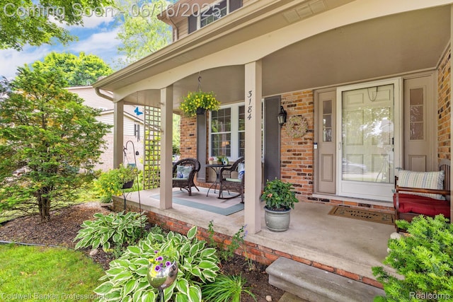 3184 Cedar Key Dr, Lake Orion, MI 48360 - property entrance with covered porch and brick siding