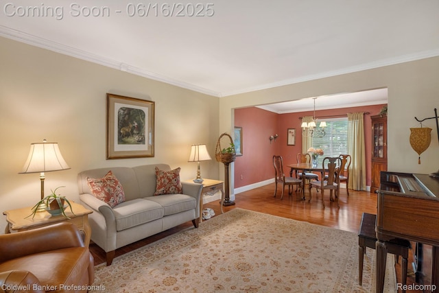 3184 Cedar Key Dr, Lake Orion, MI 48360 - living area with ornamental molding, a chandelier, and wood finished floors