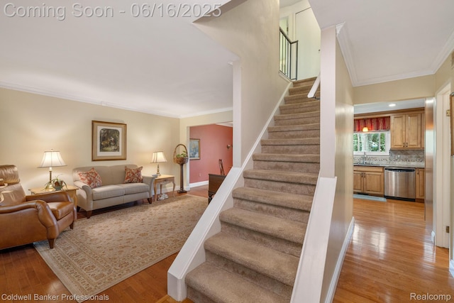 3184 Cedar Key Dr, Lake Orion, MI 48360 - stairway featuring crown molding and wood finished floors