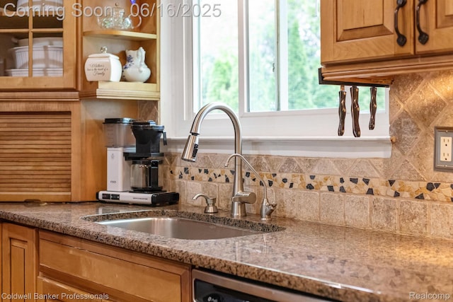 3184 Cedar Key Dr, Lake Orion, MI 48360 - kitchen with decorative backsplash, light stone countertops, dishwasher, and brown cabinets