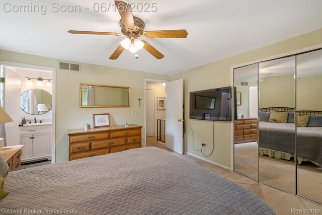 3184 Cedar Key Dr, Lake Orion, MI 48360 - carpeted bedroom with connected bathroom, ceiling fan, and a closet