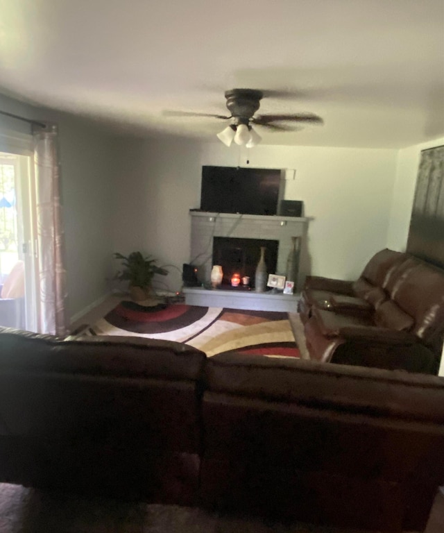 4236 Marianne Dr, Flushing, MI 48433 - living area featuring a ceiling fan and a lit fireplace