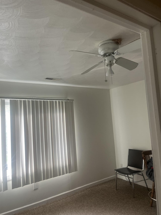 1021 2nd St, Flint, MI 48503 - empty room with ceiling fan, carpet, and healthy amount of natural light