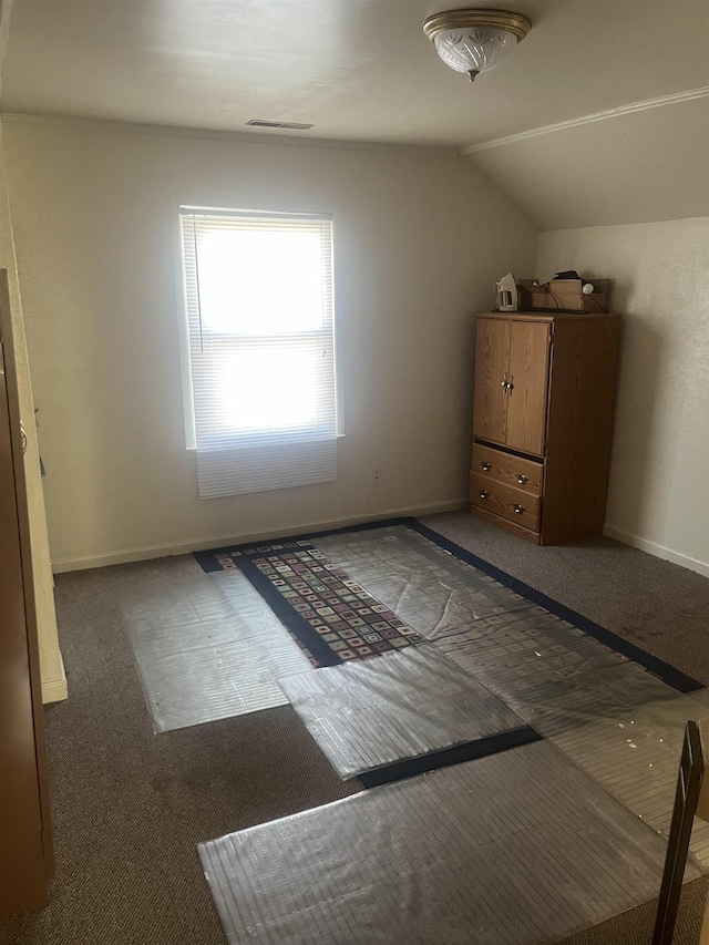 1021 2nd St, Flint, MI 48503 - unfurnished bedroom featuring carpet flooring and lofted ceiling