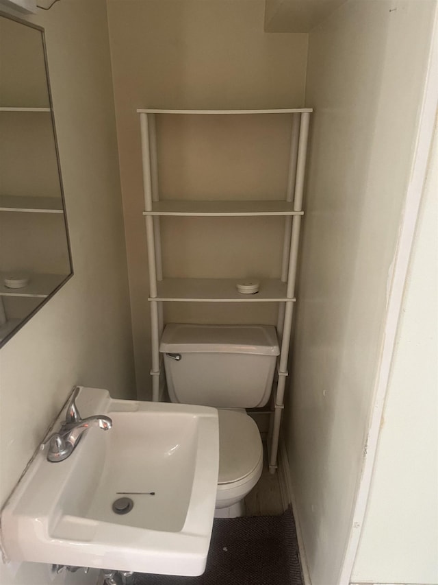 1021 2nd St, Flint, MI 48503 - bathroom featuring a sink and toilet