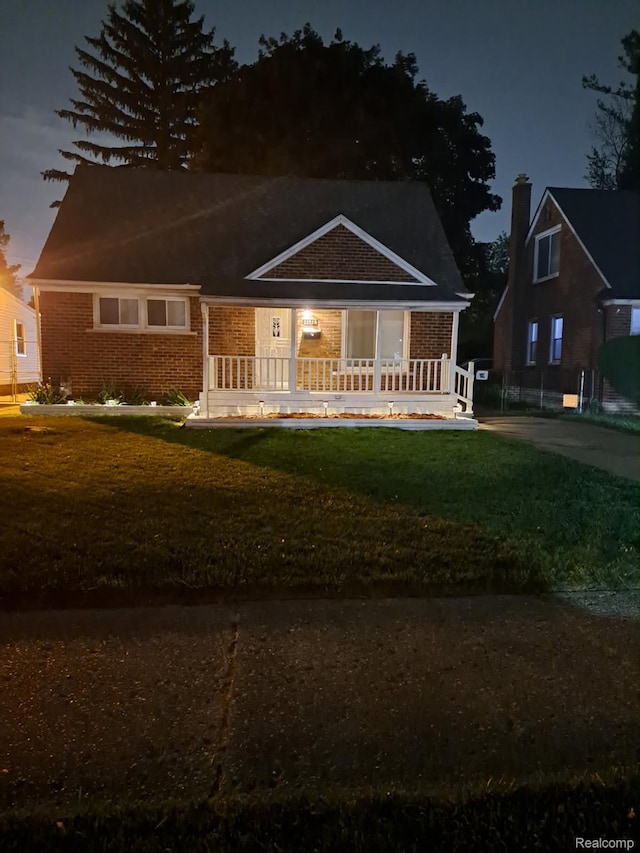 11735 Braile St, Detroit, MI 48228 - view of front of property featuring brick siding and a front yard
