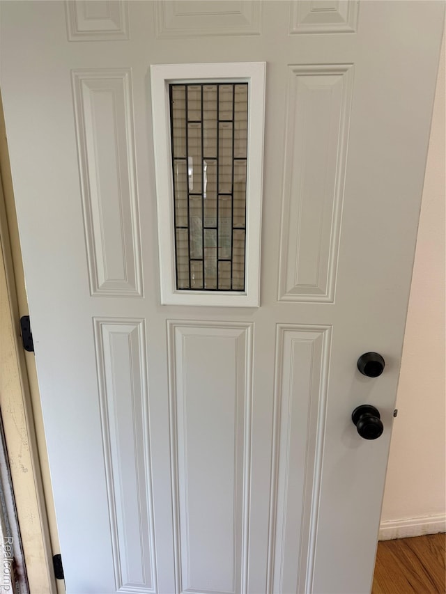 11735 Braile St, Detroit, MI 48228 - detailed view of baseboards and wood finished floors