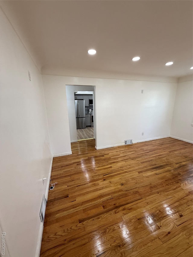 11735 Braile St, Detroit, MI 48228 - empty room with wood finished floors and recessed lighting
