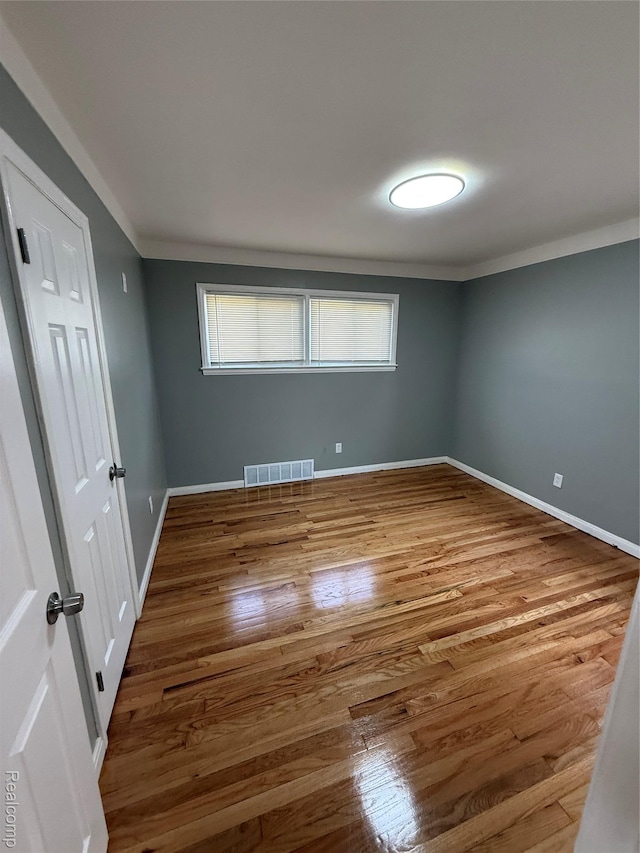 11735 Braile St, Detroit, MI 48228 - empty room featuring wood finished floors and ornamental molding