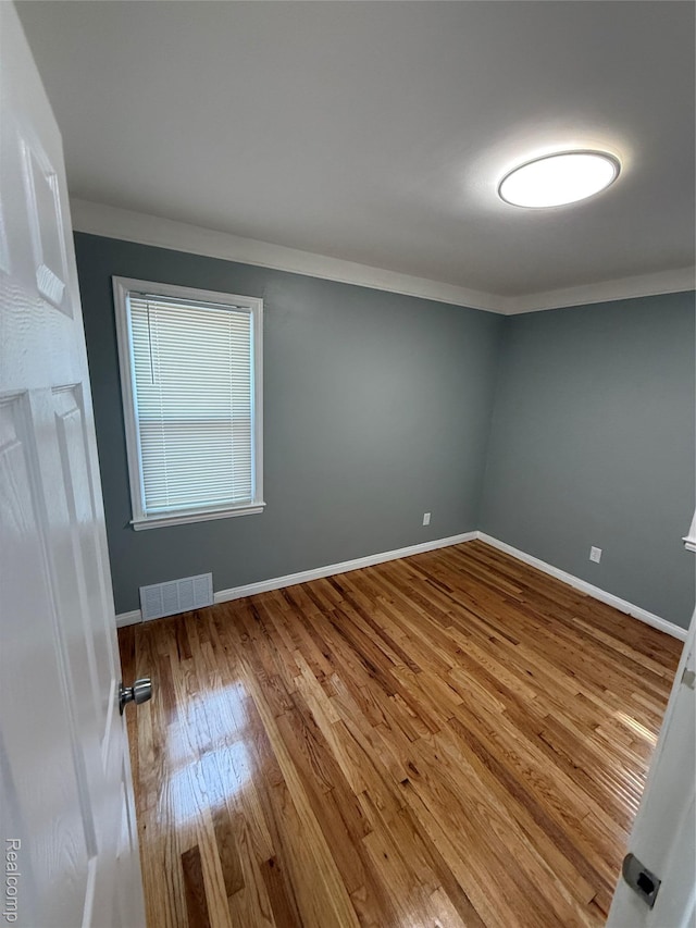 11735 Braile St, Detroit, MI 48228 - spare room with ornamental molding and wood finished floors