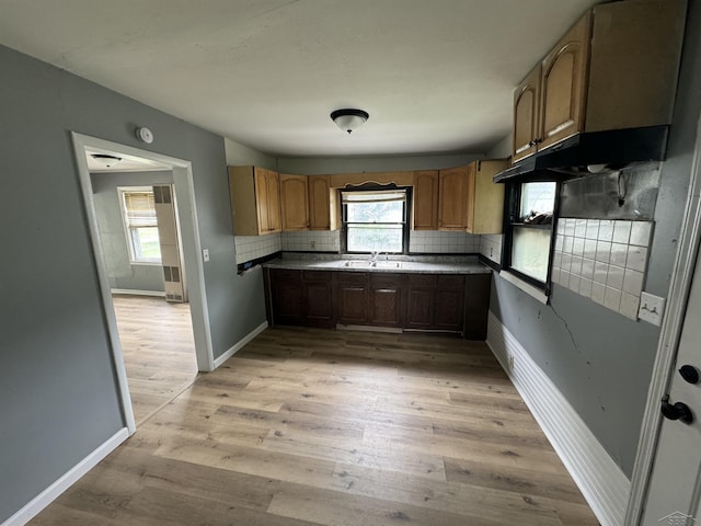 1807 Union Ave, Saginaw, MI 48602 - kitchen with plenty of natural light, light wood finished floors, and tasteful backsplash