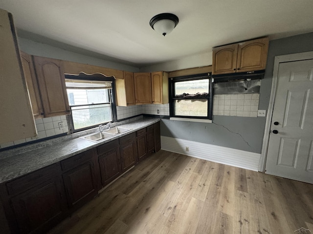 1807 Union Ave, Saginaw, MI 48602 - kitchen with light wood-style flooring and backsplash