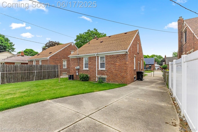 7652 Osage Ave, Allen Park, MI 48101 - back of house featuring brick siding and a shingled roof