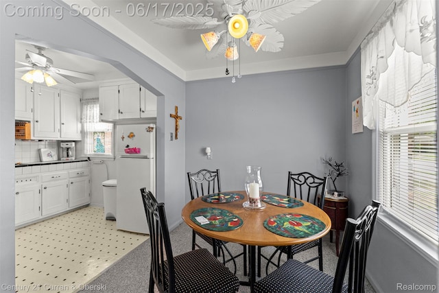 7652 Osage Ave, Allen Park, MI 48101 - dining room featuring ceiling fan and a raised ceiling