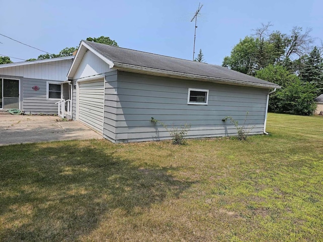 1363 Swain St, White Cloud, MI 49349 - view of home's exterior with a lawn and a garage