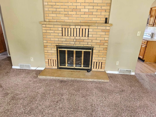 1363 Swain St, White Cloud, MI 49349 - detailed view of carpet flooring and a brick fireplace