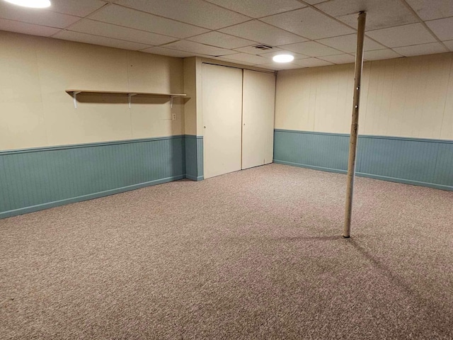 1363 Swain St, White Cloud, MI 49349 - finished below grade area with a wainscoted wall, a paneled ceiling, and carpet floors