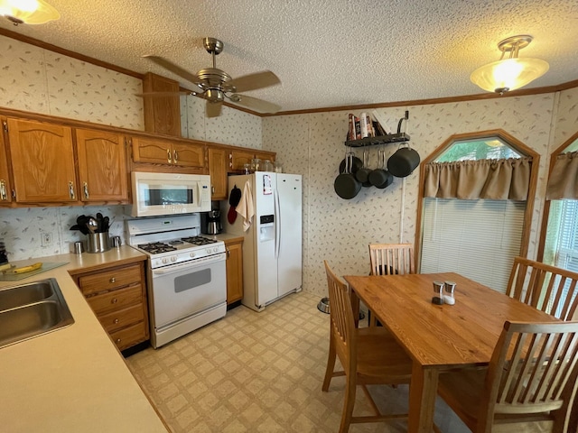 5814 N Trails End Dr, Irons, MI 49644 - kitchen featuring white appliances, crown molding, light countertops, ceiling fan, and light floors