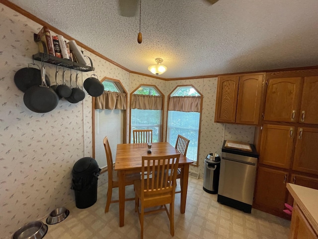 5814 N Trails End Dr, Irons, MI 49644 - dining area featuring light flooring, a textured ceiling, wallpapered walls, and crown molding
