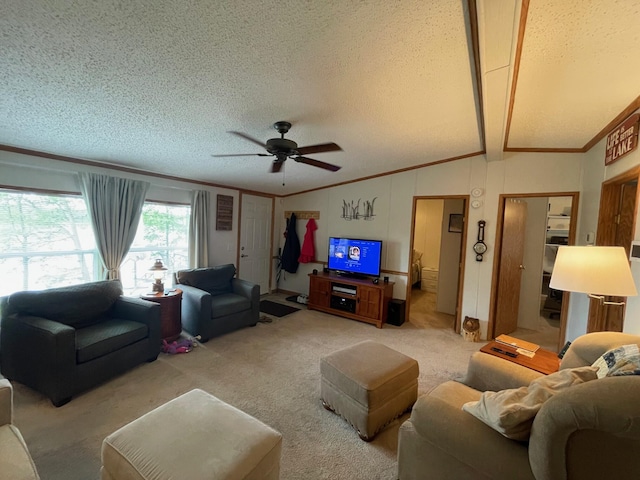 5814 N Trails End Dr, Irons, MI 49644 - living area featuring lofted ceiling, a textured ceiling, crown molding, ceiling fan, and carpet floors