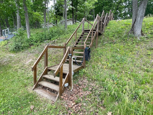 5814 N Trails End Dr, Irons, MI 49644 - view of community featuring stairs and view of scattered trees