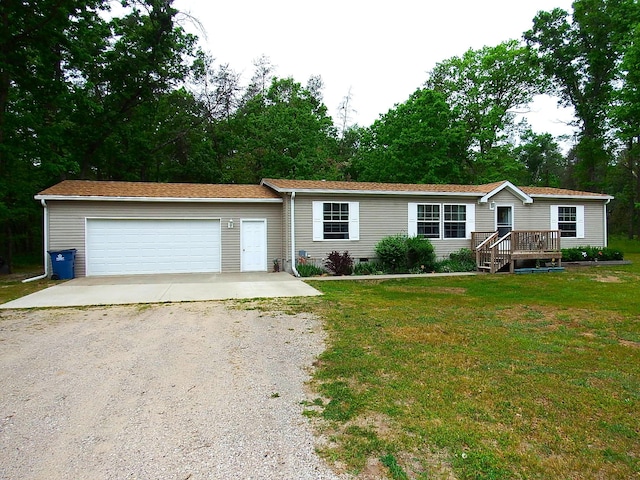 3461 S James Rd, Baldwin, MI 49304 - view of front of home with dirt driveway, an attached garage, and a front lawn