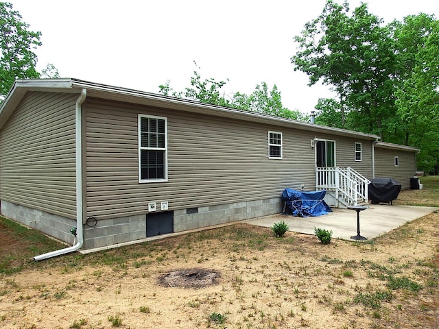 3461 S James Rd, Baldwin, MI 49304 - back of property featuring crawl space and a patio