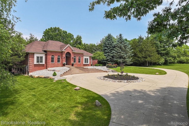 6439 Cohoctah Rd, Fenton, MI 48430 - view of front of home with brick siding and a front lawn
