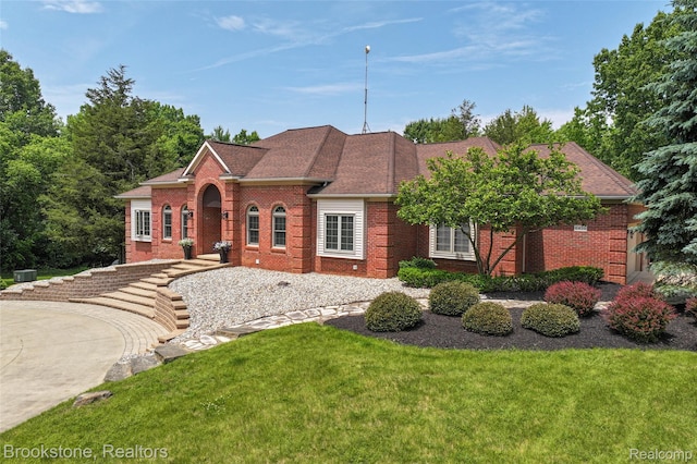 6439 Cohoctah Rd, Fenton, MI 48430 - georgian-style home with brick siding and a front yard
