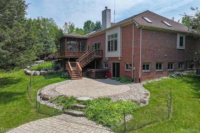 6439 Cohoctah Rd, Fenton, MI 48430 - rear view of property with a hot tub, a patio area, brick siding, a chimney, and stairs