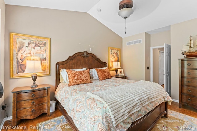 6439 Cohoctah Rd, Fenton, MI 48430 - bedroom featuring wood finished floors and vaulted ceiling