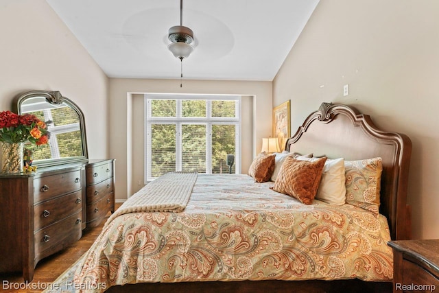 6439 Cohoctah Rd, Fenton, MI 48430 - bedroom with multiple windows, lofted ceiling, and a ceiling fan