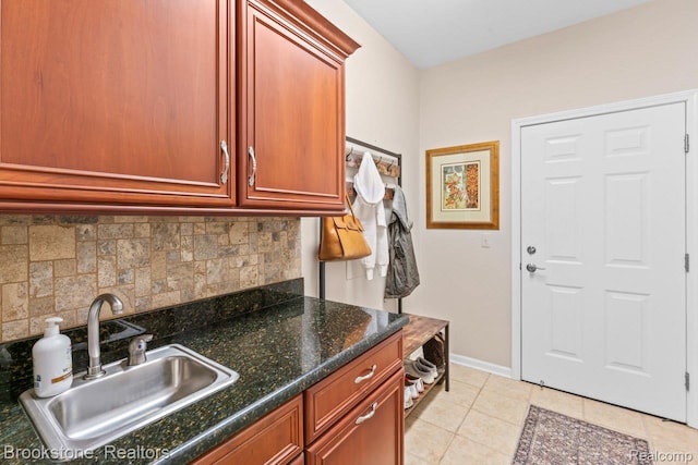 6439 Cohoctah Rd, Fenton, MI 48430 - kitchen featuring decorative backsplash, light tile patterned floors, and dark stone counters
