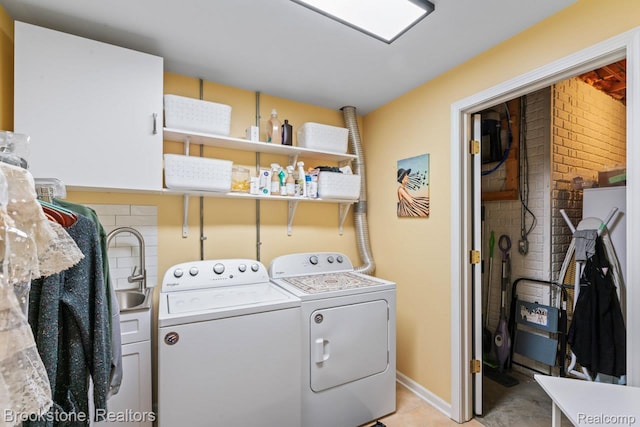 6439 Cohoctah Rd, Fenton, MI 48430 - laundry room with separate washer and dryer, cabinet space, and light tile patterned flooring
