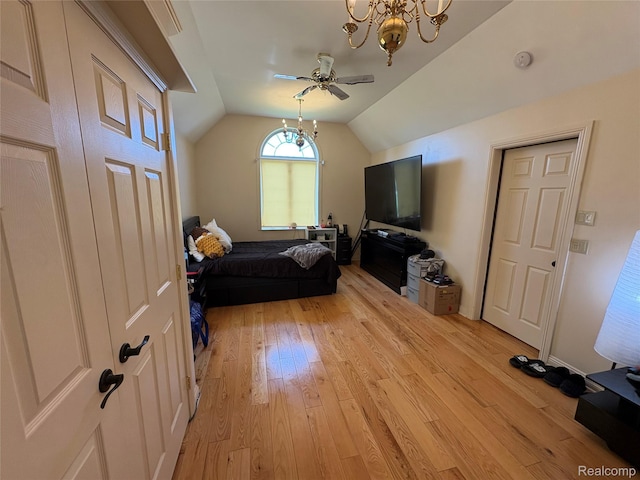 3351 Reid Rd, Swartz Creek, MI 48473 - bedroom with light wood-style flooring, lofted ceiling, a chandelier, and a ceiling fan